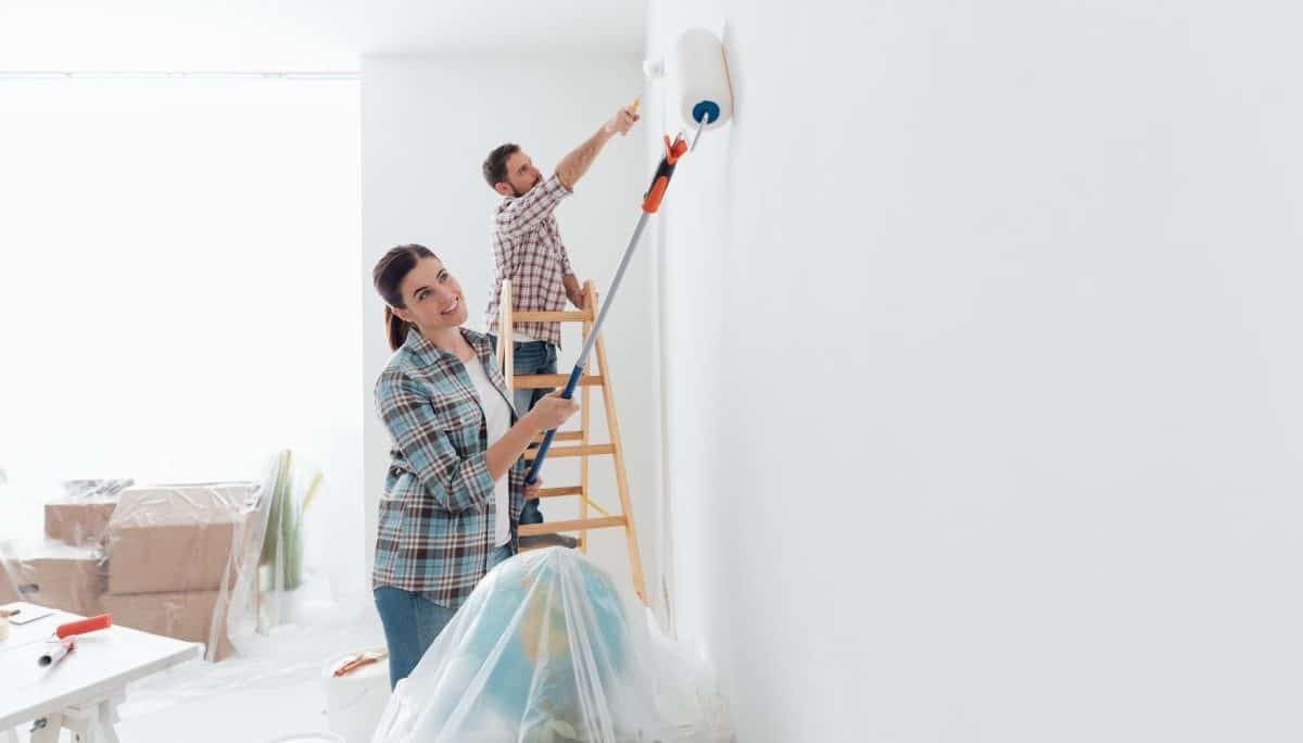 Couple Painting Wall